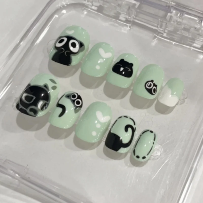 24Pcs Green Short Press on Nails Cartoon Little Black Cat Full Cover Fake Nails Set Reusable Acrylic Nail Tips for Women Girls