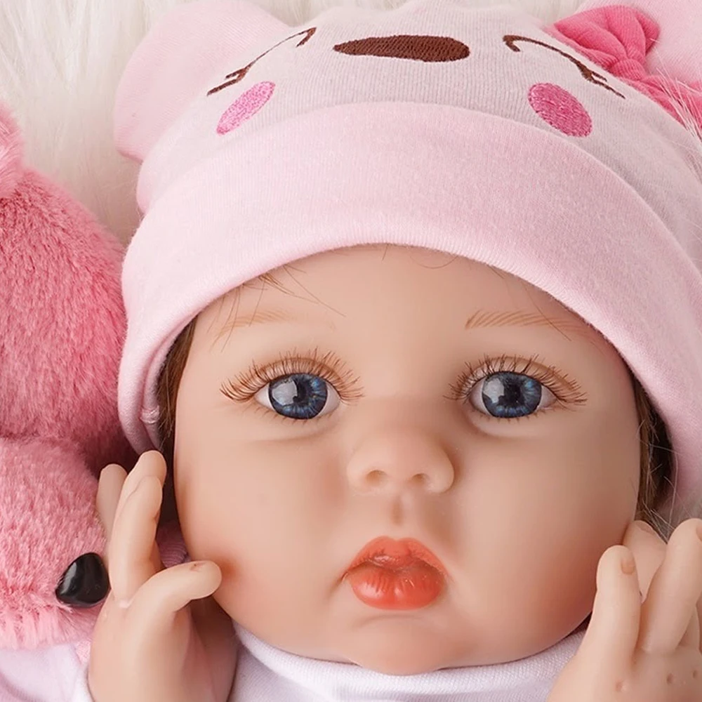 Muñeca Reborn de vinilo de 22 pulgadas |   Juguete realista para bebé con cuerpo de tela, ojos azules oscuros, extremidades ajustables, características faciales realistas,