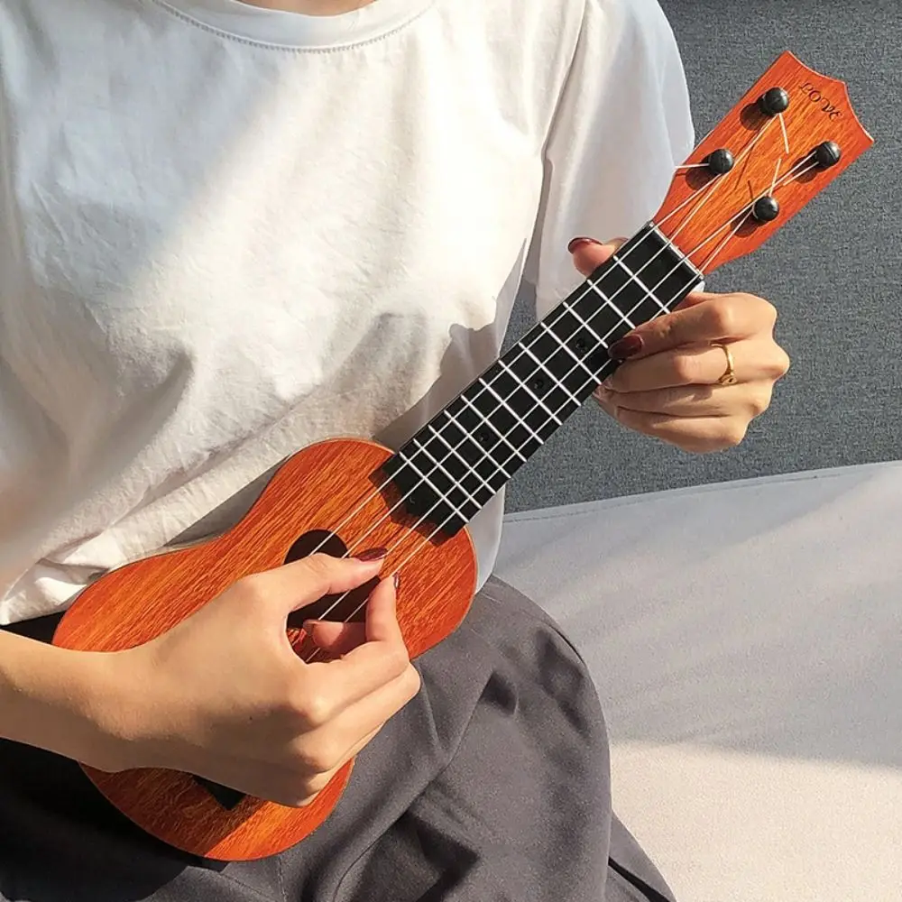 Ukelele de 4 cuerdas, instrumento Musical de juguete, perilla de cuerda ajustable, juguete de ukelele de simulación clásica, duradero y jugable