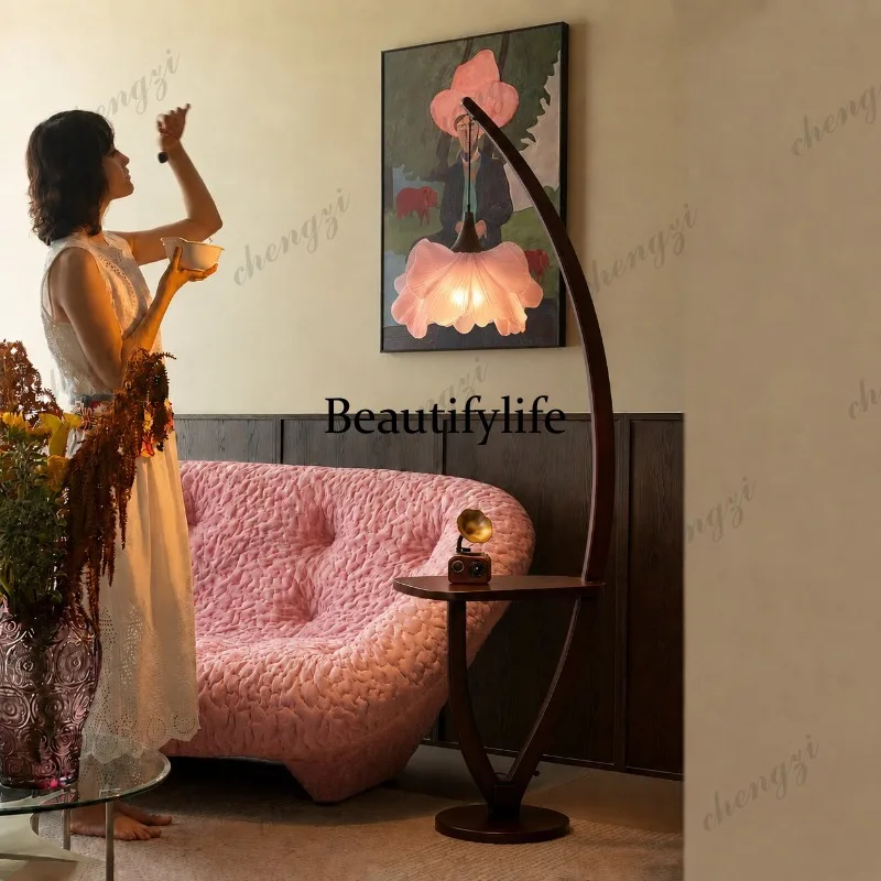 Floor-to-ceiling French antique style living room sofa decorated with pink flowers