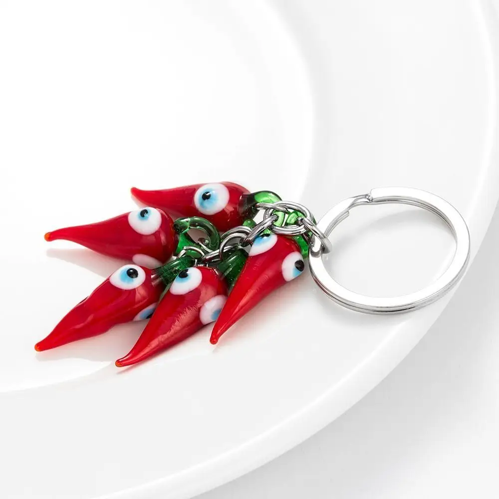 LLavero de mal de ojo de la suerte, llavero de chile rojo, llavero de mal de ojo a la moda de dibujos animados, llavero de coche de chile rojo duradero, decoración para bolso escolar