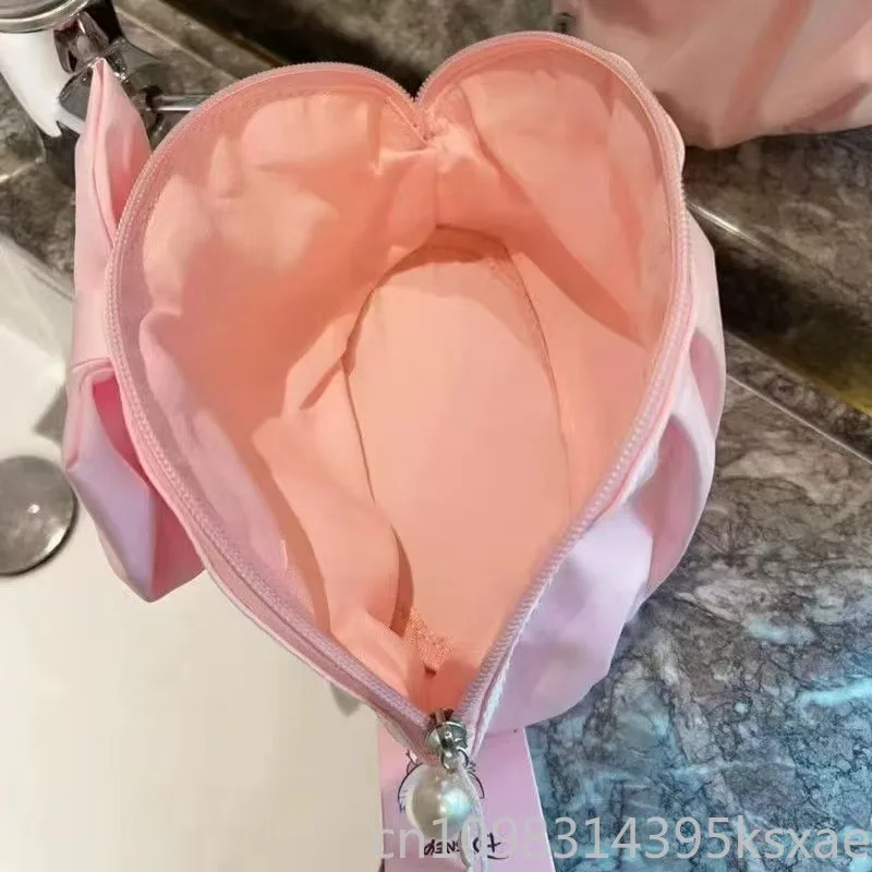 Bolsa de maquillaje de nailon Adorable de Disney, bolso portátil multifuncional, concha de dibujos animados rosa, organizador de cosméticos de tamaño Mini