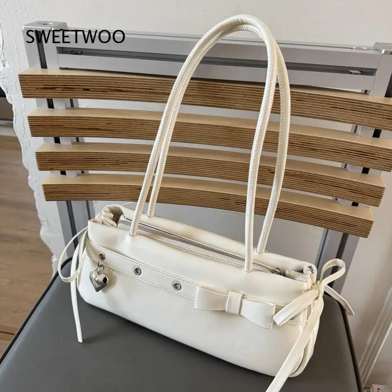 2026 Women White Bow Baguette Underarm Bag Glossy PU Shoulder Handbag With Heart Pendant