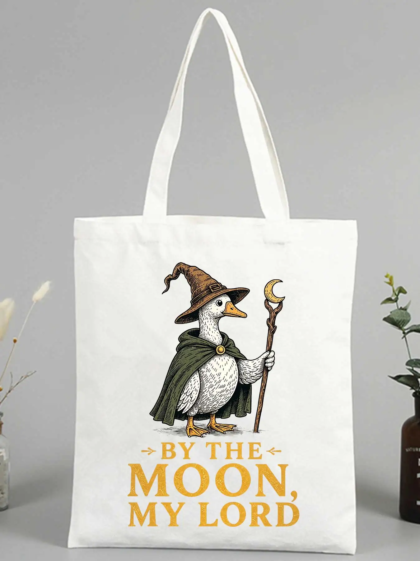 Women's canvas tote bag with wizard duck graphic and slogan-style print, ideal for casual daily use and weekend outings