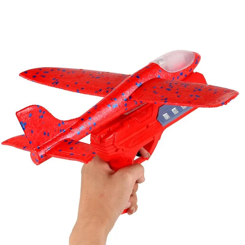 Giocattoli per bambini lancio a mano catapulta aliante pistola lanciatore netto rosso sport all'aria aperta schiuma aereo elastico luce volante giocattoli