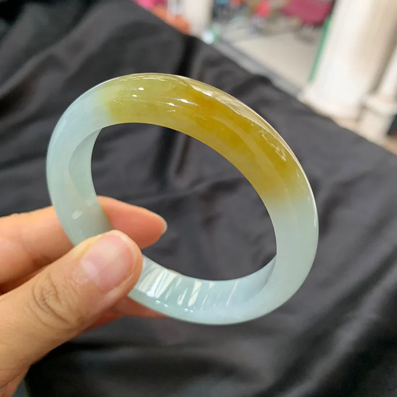 Genuine natural Burmese jade bracelet, featuring ice-like jadeite with a yellow hue and floral patterns, a classic circular desi