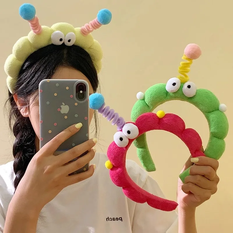 A cute girl's plush hair band with big eyes and curly hair a quirky and twisty hairpin hair accessory for selfies wholesale