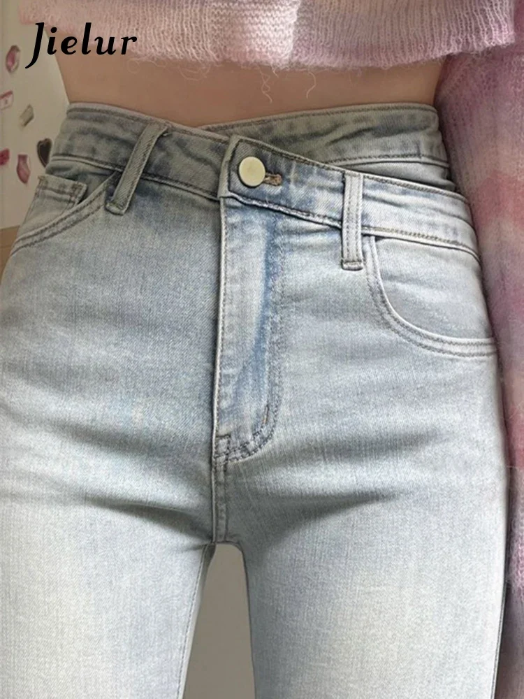 Jielur unregelmäßige hellblaue Herbst Damen Jeans Mode Büro Dame hohe Taille schlanke enge Hüfte Reiß verschluss einfache weibliche Flare Hosen