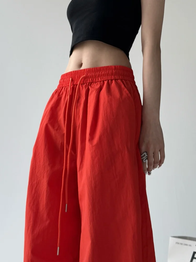 Eleganckie pomarańczowe spodnie robocze damskie na wiosnę i lato, cienkie, plisowane, z szerokimi nogawkami, codzienne spodnie, wygodne, luźny krój, wysoki stan, materiał nylonowy.