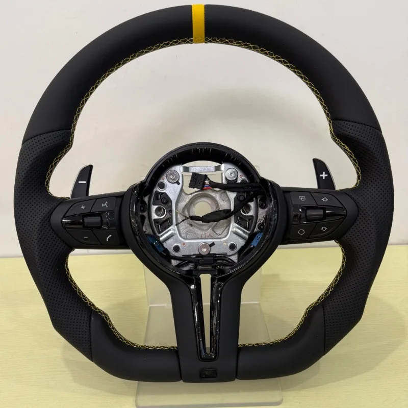 New yellow stitching re-emblems, old renovated steering wheel assembly