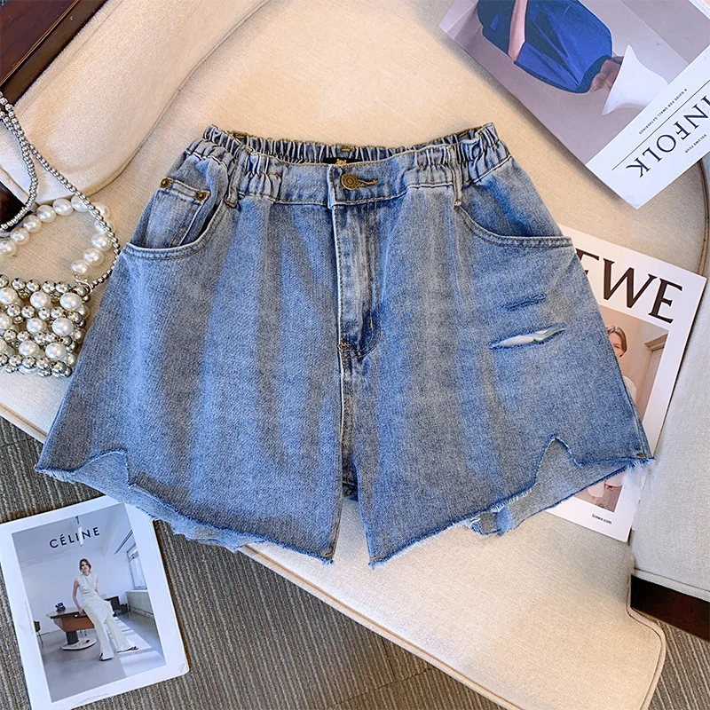 Plus-size women\'s summer denim shorts Washed denim fabric ripped design Street shorts Commuter party jeans asymmetrical design