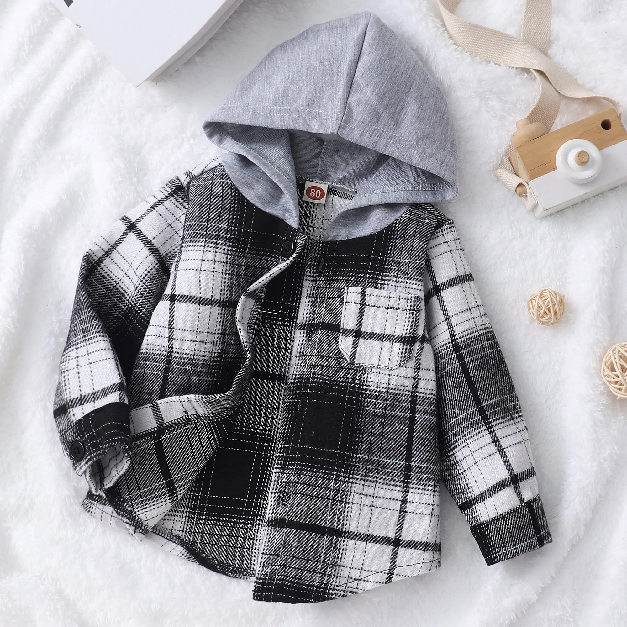 

Male baby long sleeved checkered hooded shirt top
