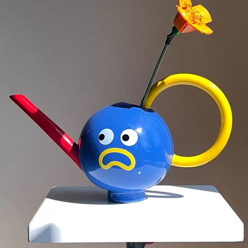 

Big eyes fun contrasting color ceramic flower watering device, long mouth watering kettle