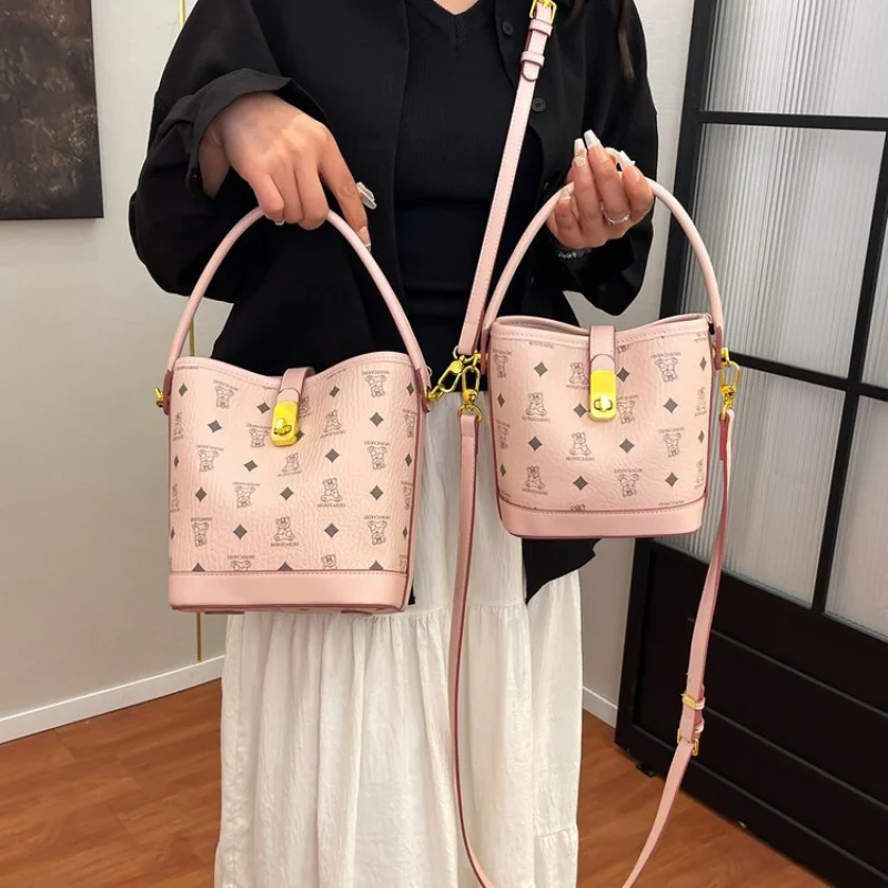 

Classic Leather Shoulder Bag For Ladies By Luxury Brand, Soft Material With Gold Accents, Spacious Enough For Essentials