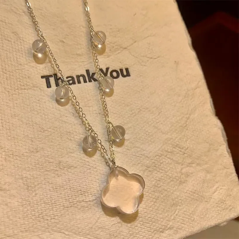 Crystal necklace Mozambique powder crystal four-leaf clover silver chain small light bulb niche temperament transparent water