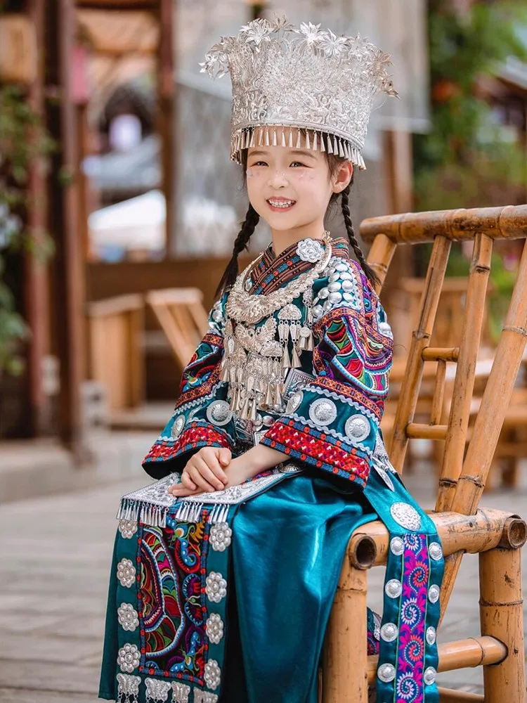 A complete set of ethnic costumes family parent-child wear dark green embroidered top and long ribbon dress