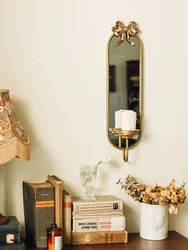 Elegant Gold Metal Mirrored Wall Sconce with Bowtie Accent