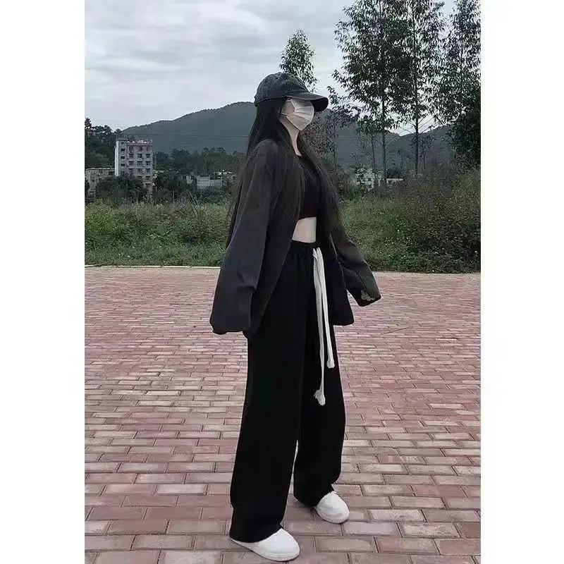 بنطال ذو قصة أرجل واسعة للنساء صيفي رفيع للغاية مثقوب مفرغ واسع الأرجل مقسم محب ناعم مطابق للتهوية قابل للتمدد 2025