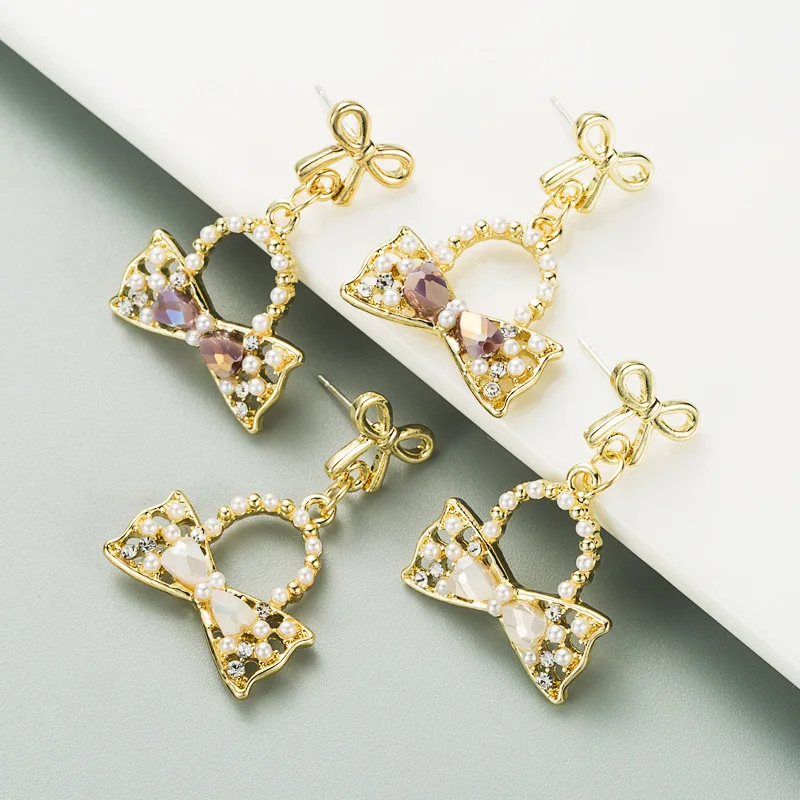 Korean new small fragrance fresh bow pearl earrings alloy diamond set S925 silver needle temperament fashion earrings