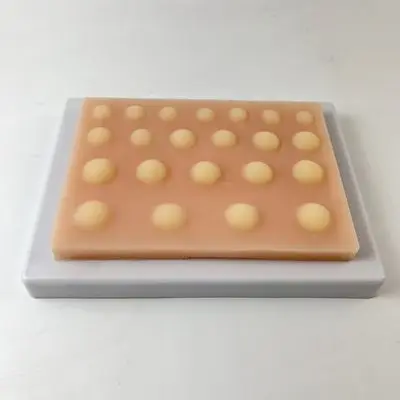 Skin cyst excision practice module, medical student training and suturing instruction