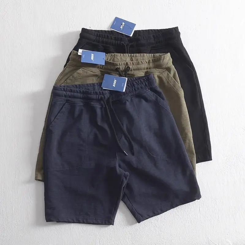 Summer and autumn simple looped loose straight tube sports and leisure pure color combed cotton beach shorts for men