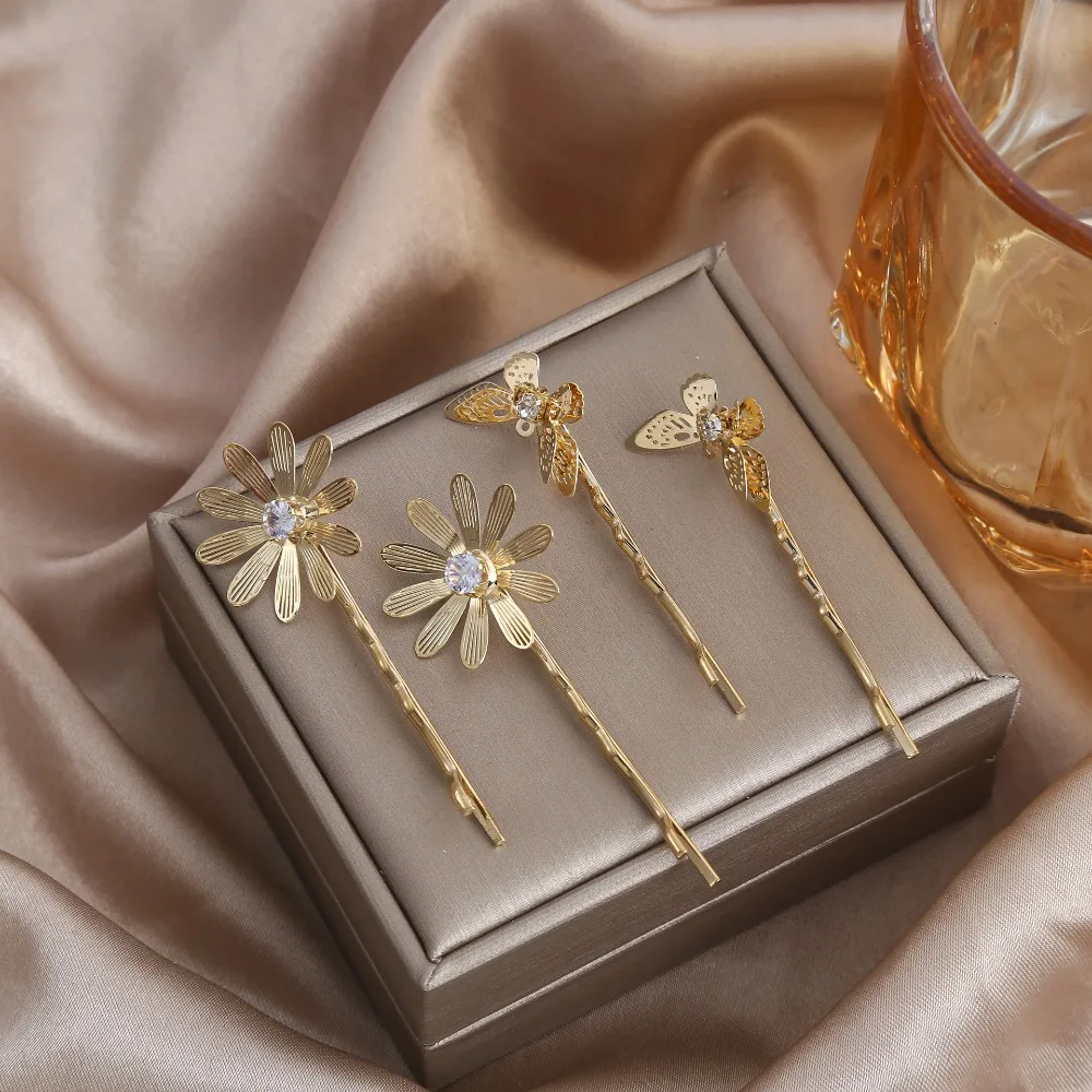 

1 пара красивых заколок для волос с золотым цветком для женщин