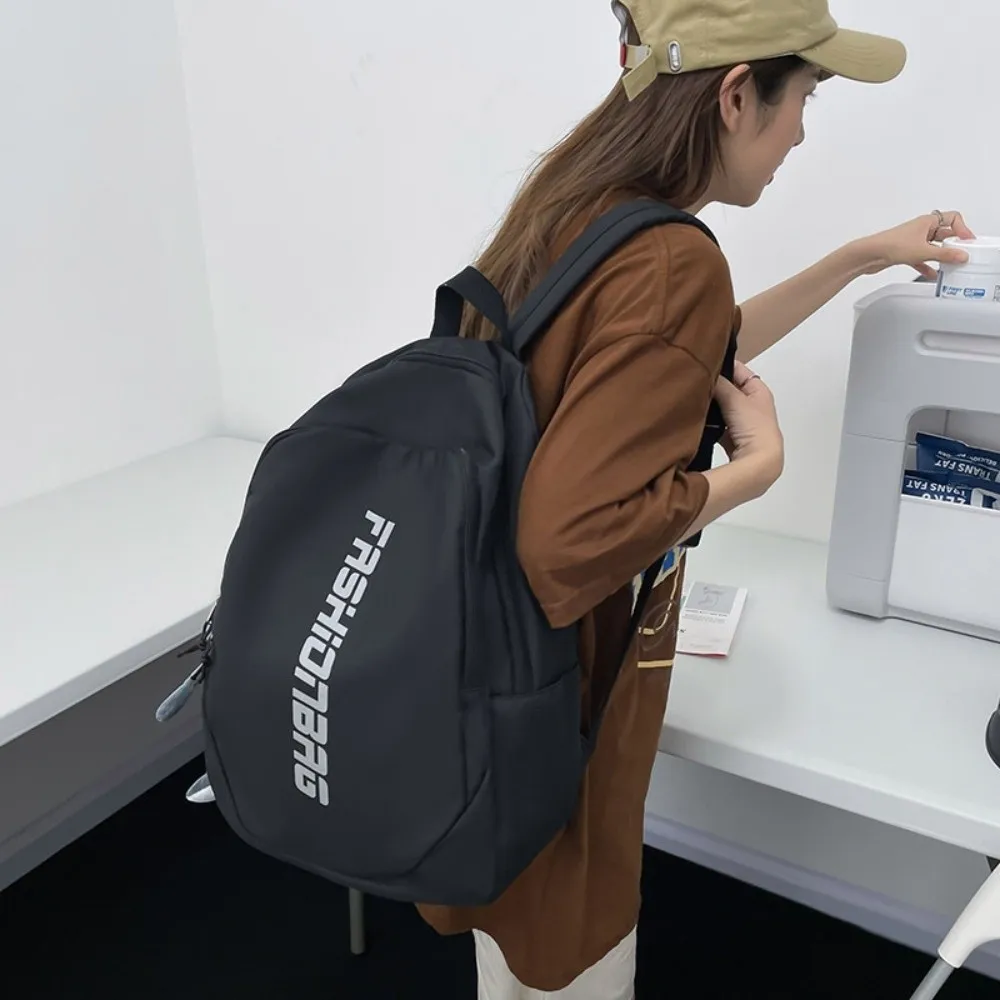 Nueva mochila escolar de gran capacidad, bolsa universitaria ligera con letras, bolsa de libros impermeable