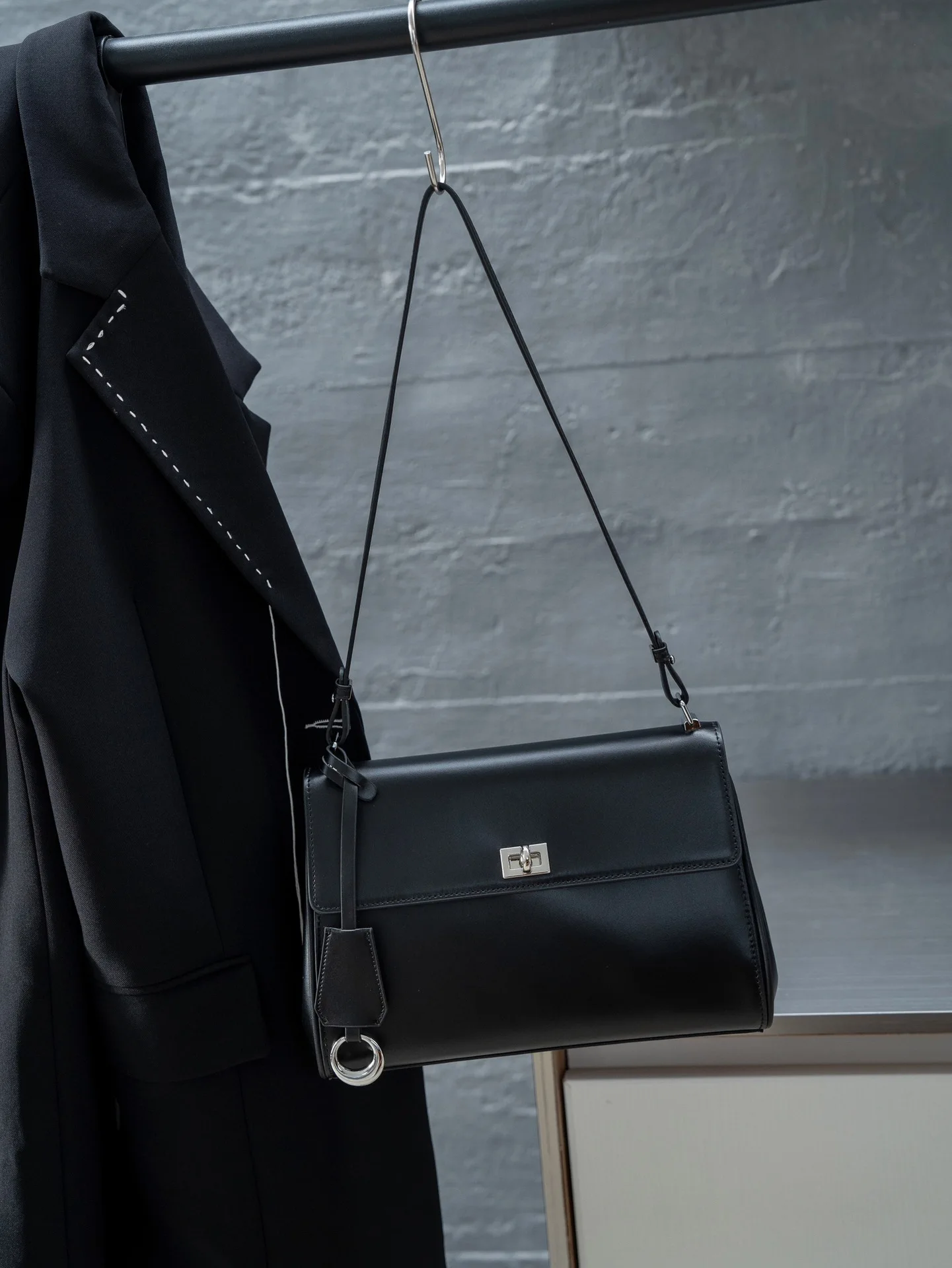 

Classic 2025 lock-flap satchel. Crafted from, this roomy tote offers chic shoulder/crook-of-arm carry. Timeless & spacious.