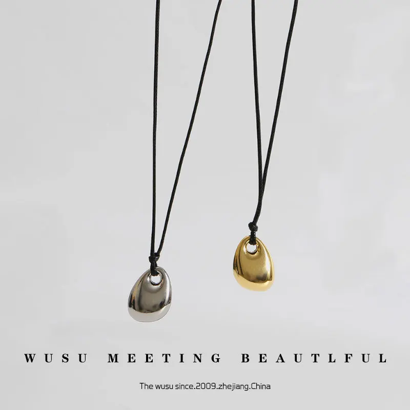 

Titanium steel gold bean necklace collarbone chain long black rope leather rope fashionable couple pendant