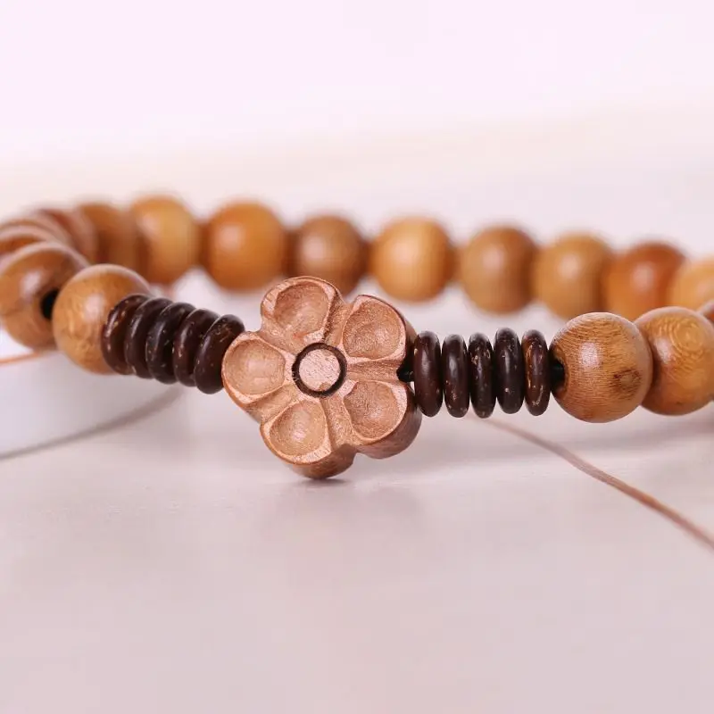 

New Chinese-style old peachwood, small-leaf rosewood, coconut shell, plum blossom, cinnabar bracelet, vintage cultural and c