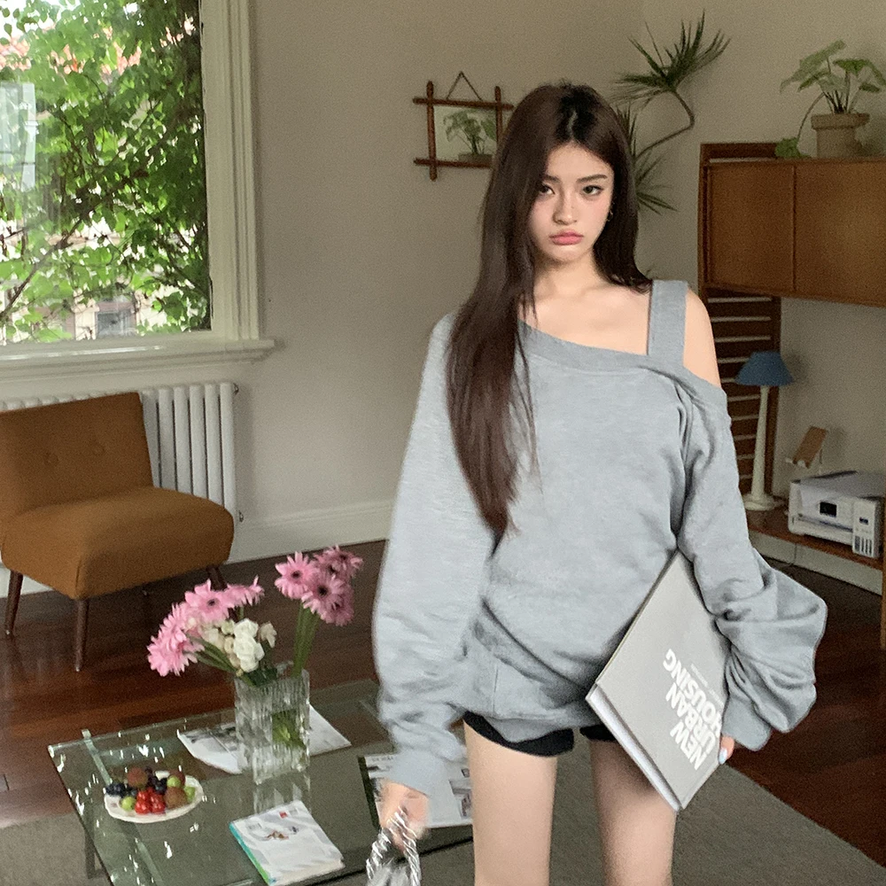 

2024 autumn and winter new design sense hollow out fashionable and relaxed off shoulder hoodie loose casual top for women's fash