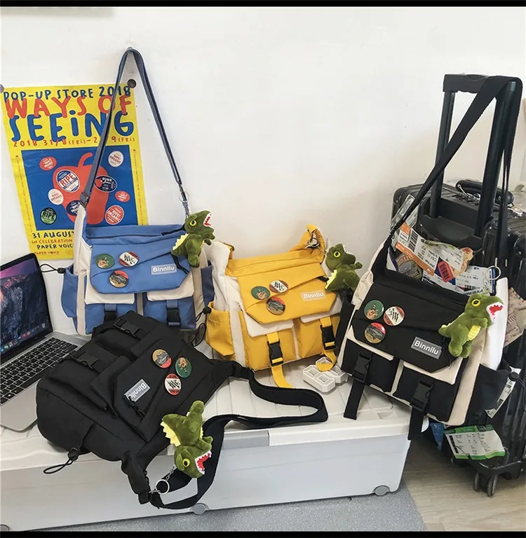 

Crossbody bag men's 2025 new large-capacity contrasting color canvas bag women's shoulder bag street trend student school bag co