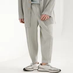 Pantaloni pieghettati Miyake pantaloni Harem pantaloni elastici in vita a metà cucitura pantaloni larghi Casual tagliati abbigliamento da uomo moda in stile giapponese