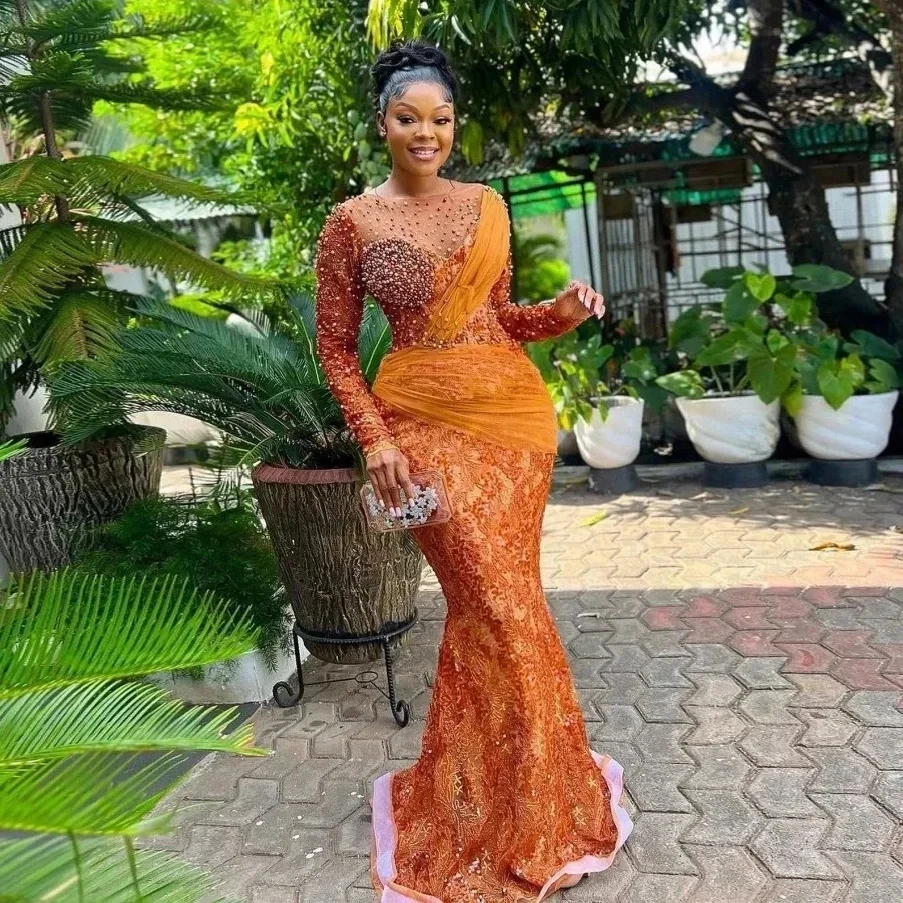 فساتين سهرة برتقالية أفريقية Aso Ebi حورية البحر بأكمام طويلة من الدانتيل واللؤلؤ للحفلات الراقصة للفتيات السود حسب الطلب