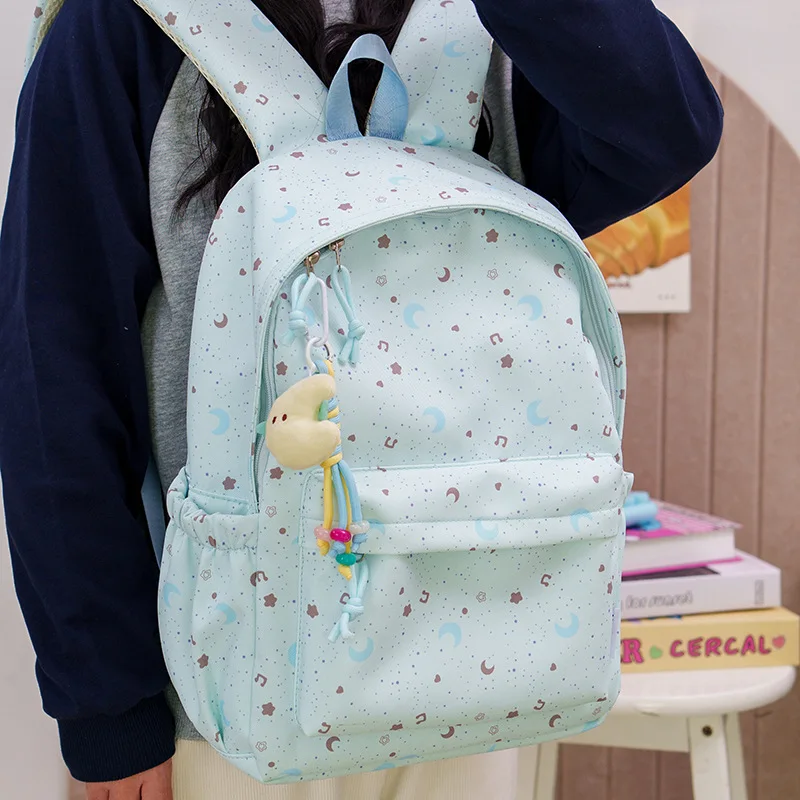 Large-capacity printed star and moon student schoolbag, breathable wide shoulder strap, cute girl travel backpack