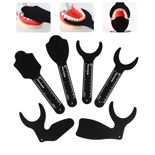 Tablero de contraste de imagen de foto de fondo negro de ortodoncia Dental, placa de mejilla Oral de Metal con marca de escala, herramientas esterilizables en Autoclave