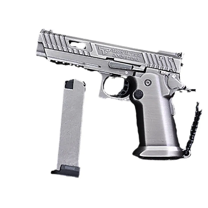Nouveau 1:3 TTI2011 Mini alliage pistolet modèle porte-clés pendentif détachable décompression jouet coquille Pop-up hommes cadeau 10 balles