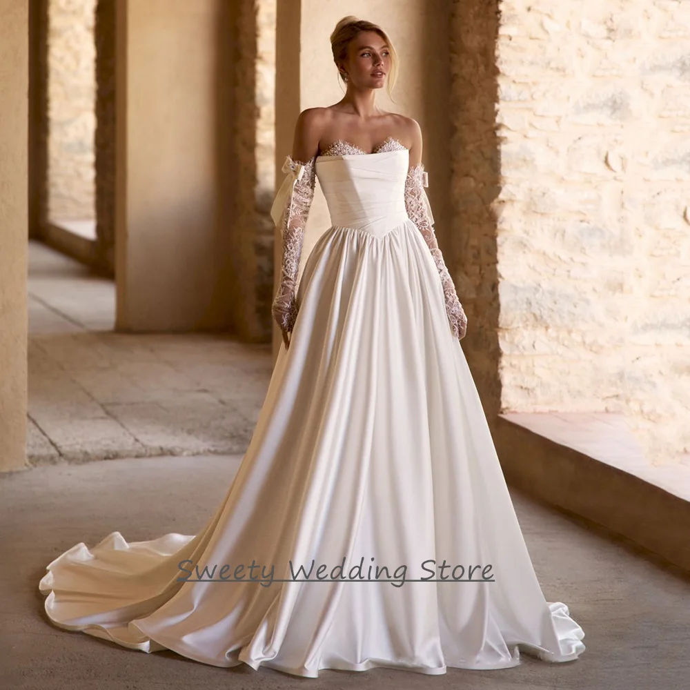 

Customized Wedding Dress for Woman Bride Charming Sweetheart Long Sleeves Pearls Lace Draped Skirt A Line Bridal Gown