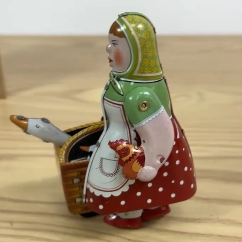 

Walking Tin Farmer Robot Woman with The Goose Clockwork Toy Classic Collection Retro Wind Up Toy MetalMechanical Toy Gift