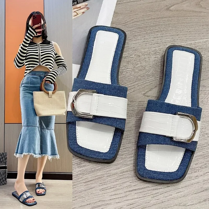 

In the summer of 2024, European and American metal buckle flat bottomed square toe slippers, open toed beach sandals for women