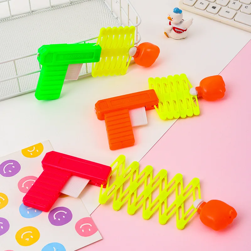 Children's April Fool's Day Prank Novelty Funny Toy Retractable Fist Shooting Skill Gun Decompression Retractable Classic Toy