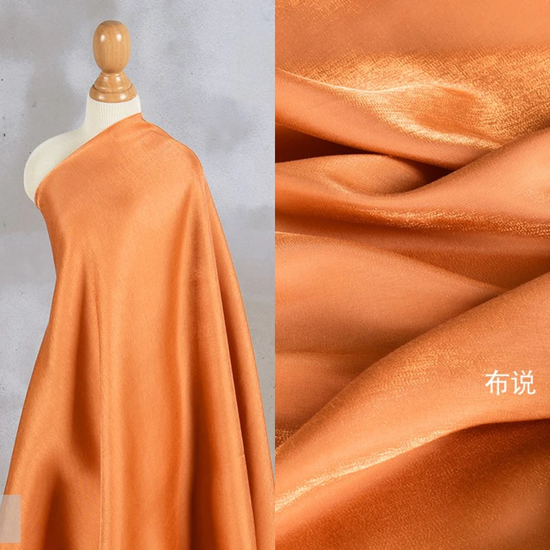 Arancione lucido Lucite Illusion tessuto camicia di raso colorato cristallo sirena Ji Laser Hanfu tessuti di seta oro e argento