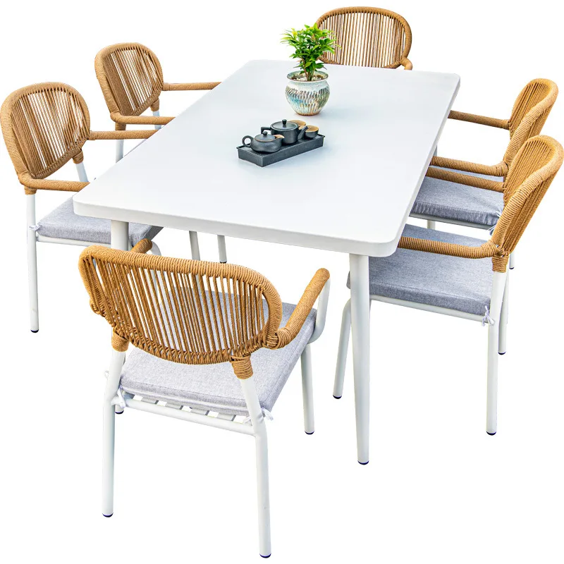 

Nordic outdoor rattan high-end outdoor tables and chairs courtyard garden plastic wood table simple casual white table