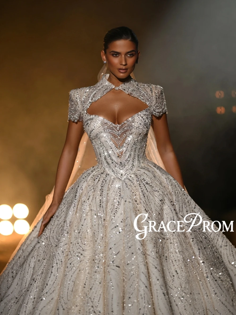 

Glam Modern Ball Gown Wedding Dress Sparkling Sequins Intricate Cutout Neckline Short Sleeves Statement Cathedral Train Wear