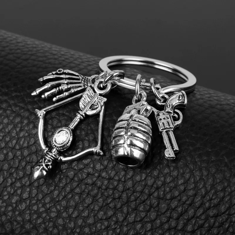 ウォーキングデッドキーチェーンガンメタル弾丸銃のペンダント、時映画の車のキーホルダー、trinketキーホルダー