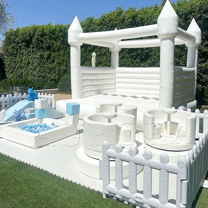 Commercial-grade white inflatable castle set for kids' parties, featuring a ball pit, slide, and soft play equipment.