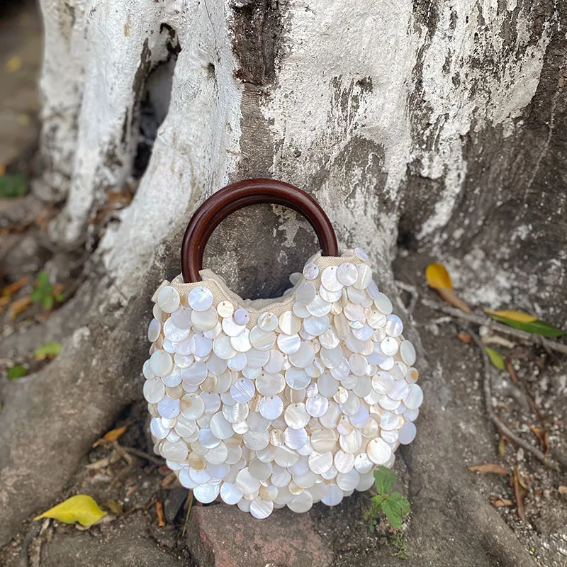 Spring and summer new high-end pure handmade natural shell bag fairy handheld bag personalized trend niche bag