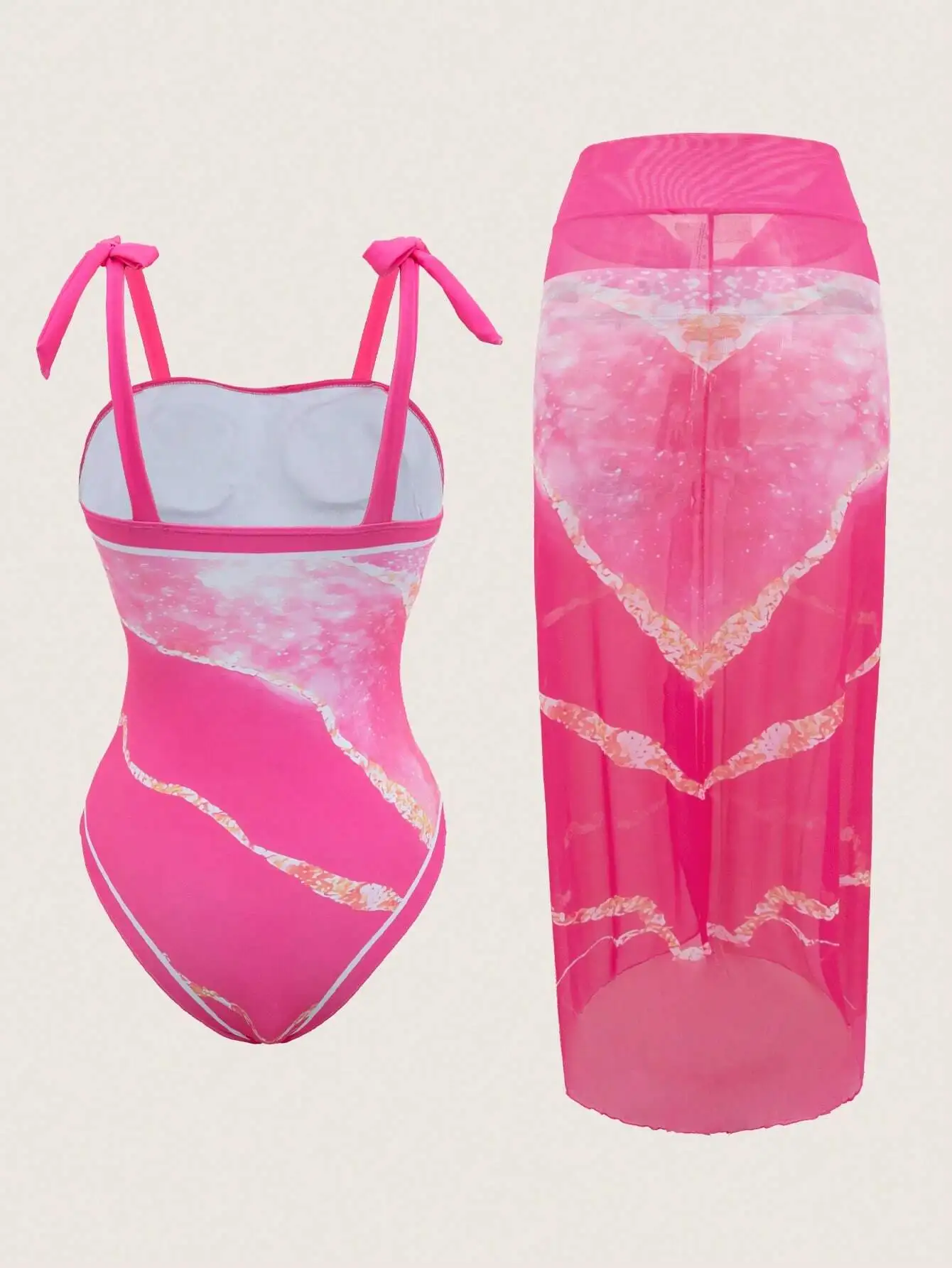 

Женский розовый купальник с принтом и прозрачной юбкой-накидкой в комплекте