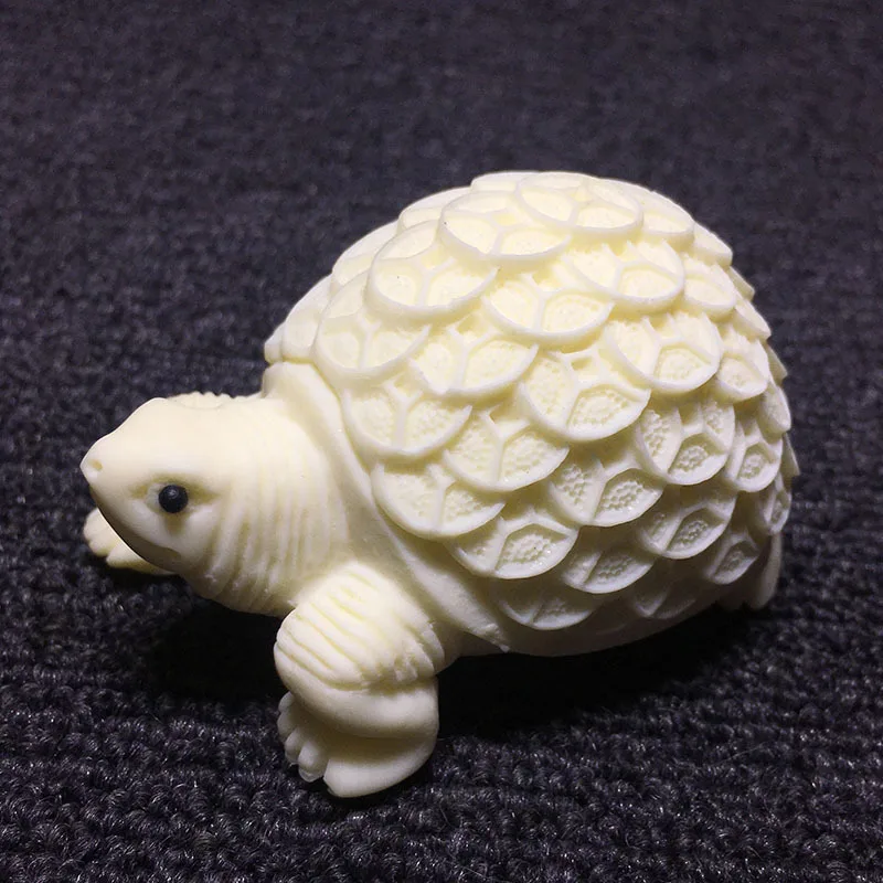 

Ivory Nut Carved Money Turtle8.5*4.5*5cmBodhi Seeds Coconut Wood Crafts Tea Ornaments Crafts Ornaments