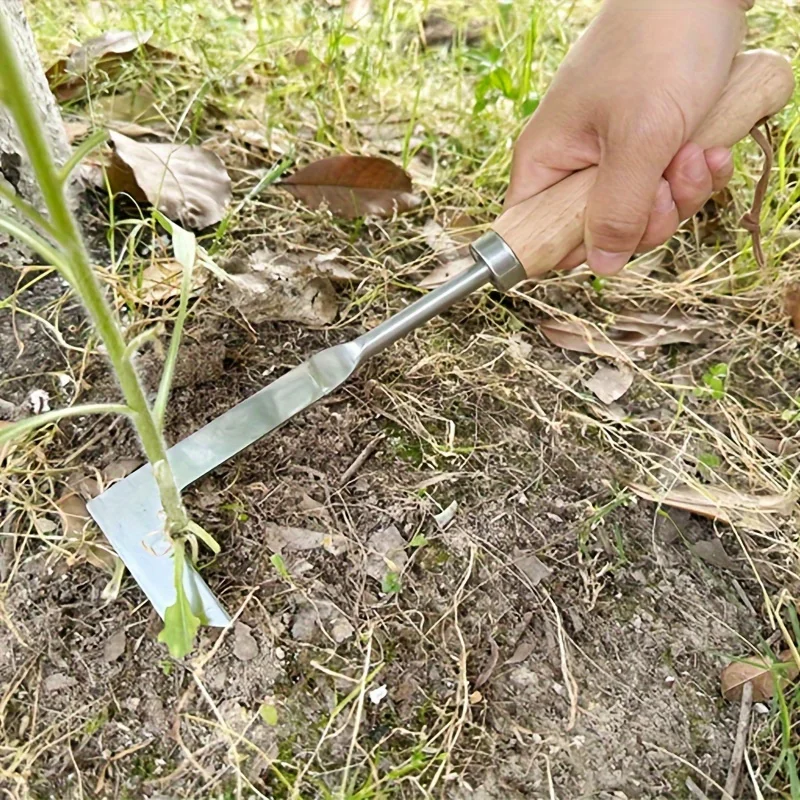 Un pezzo di sarchiatore manuale in acciaio inossidabile dotato di ingranaggi, progettato per un'efficiente mantenimento stradale e la rimozione delle erbacce.